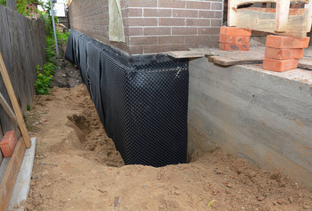 Happy homeowners after waterproofing job in Clarence